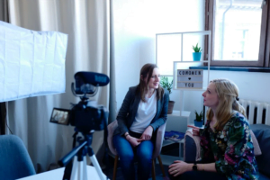 Two women recording a video