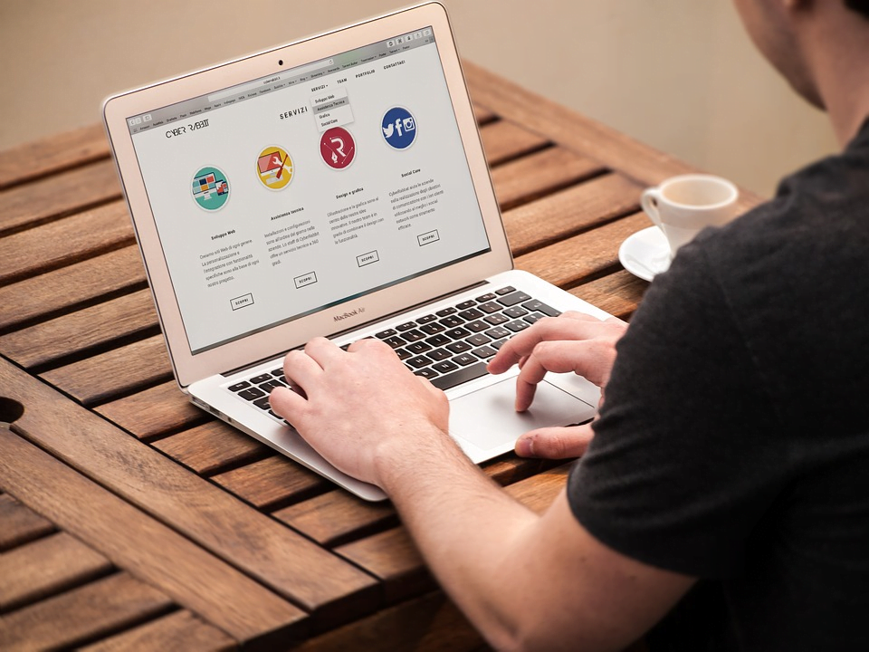Professional working on a laptop in a white-label reseller agency in NYC