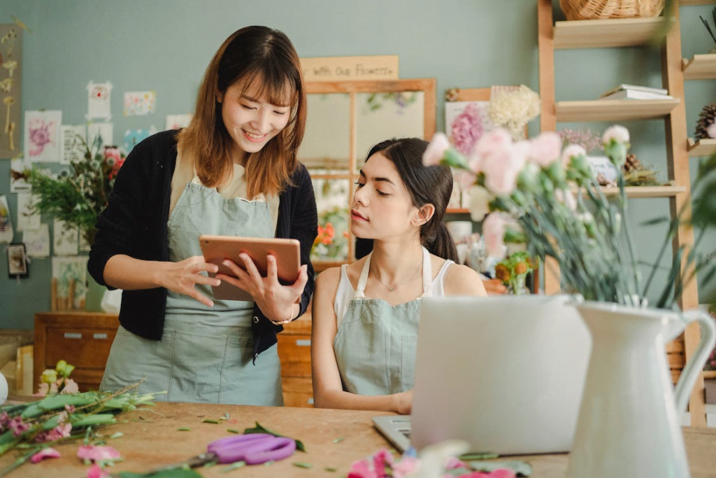 woman reading positive reviews for the flower shop