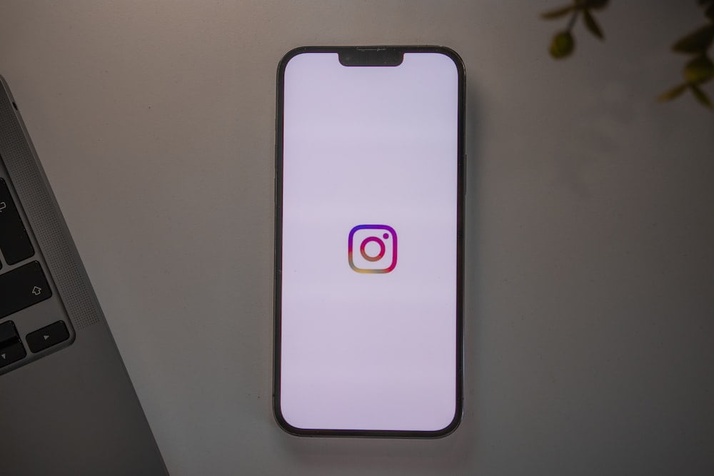 Instagram app opening on a phone