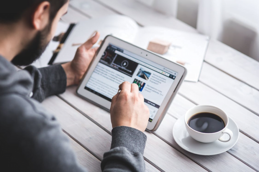 a person browsing a website using a tablet
