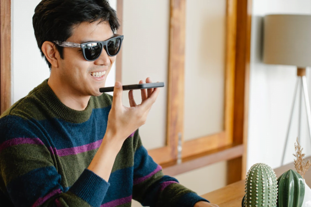 a visually-impaired person using voice search on his phone